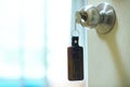 House key with wooden home keyring in keyhole, property concept Royalty Free Stock Photo