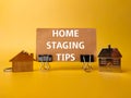 House keychain and card board with the word HOME STAGING TIPS