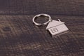 House Keychain On A Wooden Background