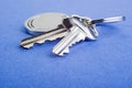 House Keys on Blue Textured Background Royalty Free Stock Photo