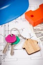 House keys, currencies dollar, electrical construction diagrams and work tools for engineering jobs. Building or buying home Royalty Free Stock Photo