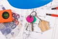 House keys, currencies euro, electrical construction diagrams and work tools for engineering jobs. Building or buying home Royalty Free Stock Photo