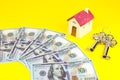 House, keys and dollars. Buying and renting real estate. Bank credit for property. Save money. Invest for future home Royalty Free Stock Photo