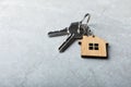 House keys with a keychain in the shape of a house. Royalty Free Stock Photo