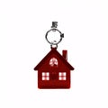 House keys with red house shaped keys are on a white background. Royalty Free Stock Photo