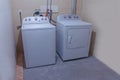 House laundry room. A Laundry Machine High Efficiency Top Load Washer