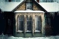 House with long icicle on house covering frozen windows Royalty Free Stock Photo