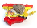 House and loupe on the map of Spain in colors of spanish flag. S