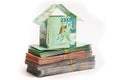 House made of banknotes of Kazakh money stands on packs of tenge. Mortgage concept, real estate appreciation