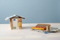 House made of Euro money banknotes next to a calculator and a pile of money Royalty Free Stock Photo