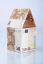 House made from euros with reflection Royalty Free Stock Photo