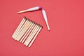 House made from matches on red background Royalty Free Stock Photo