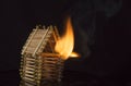 House made of matches is set on fire Royalty Free Stock Photo