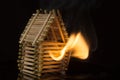 House made of matches is set on fire Royalty Free Stock Photo