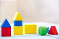 House made of old cubes. Wooden colorful building blocks. Vintage childrens toys. the concept of building a house, apartments for