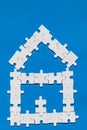 House made of puzzles. Modern house puzzle white pieces for concept design. Jigsaw Home, building, exterior. Puzzle construction Royalty Free Stock Photo