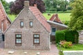 House made of red clincker bricks surrounded by green trees Royalty Free Stock Photo