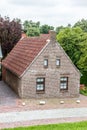 House made of red clincker bricks surrounded by green trees Royalty Free Stock Photo