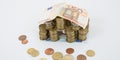 House Made From Stack Of Coins And Banknote Roof real estate Royalty Free Stock Photo