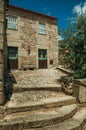 House made of stone with large steps and wooden door Royalty Free Stock Photo