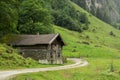 house made of stone in mountains of Alps Royalty Free Stock Photo