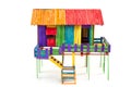 The house is made of toys from colorful popsicle sticks on a white background.