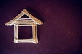 House made of white straw on a purple background. Handwork Royalty Free Stock Photo