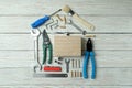 House made of working tools on white wooden background Royalty Free Stock Photo