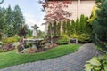 House Manicured Frontyard with Water Fountain