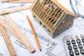 House miniature under construction on an architect desk Royalty Free Stock Photo