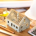 House miniature under construction on an architect desk Royalty Free Stock Photo