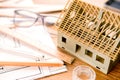 House miniature under construction on an architect desk Royalty Free Stock Photo