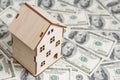 House model on background of U.S. one hundred dollar bills. Property investment, home loan, house mortgage, real estate concept Royalty Free Stock Photo