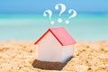 House Model With Question Marks On Sand Royalty Free Stock Photo