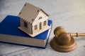 House model on book with judge Royalty Free Stock Photo