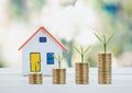 House model and coin money,mortgage and real estate investment. Royalty Free Stock Photo