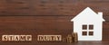 House model, cubes with text Stamp Duty and coins on wooden background. Banner design Royalty Free Stock Photo