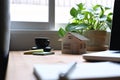 House model, documents and laptop on wooden table. Mortgage and real estate investment. Royalty Free Stock Photo