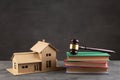 House model, gavel and books on the desk, Real property law concept, real estate auction Royalty Free Stock Photo