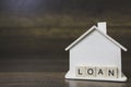 House model with loan word on wooden blocks