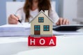 House Model Over HOA Blocks Over Desk In Office Royalty Free Stock Photo