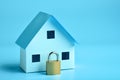 House model and padlock: protection and security concept Royalty Free Stock Photo