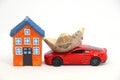 House model with red car and money. Royalty Free Stock Photo