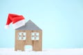 House model with red santa hat Royalty Free Stock Photo