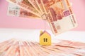 House model set on banknote for concept investment mortgage fund finance and home loan.Small wooden house on the Royalty Free Stock Photo