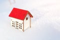 House model at snow background. Winter. Protecting and isolating house. Preparing the house for winter time. Real estate and