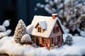 House model in a snowy setting, emphasizing winter heating concept Royalty Free Stock Photo