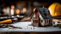 House model standing on blueprint with keys and construction tools Royalty Free Stock Photo