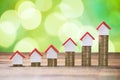 House Models Placed On Top Of Stacked Coins Royalty Free Stock Photo