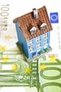 House with money - mortgaging concept Royalty Free Stock Photo